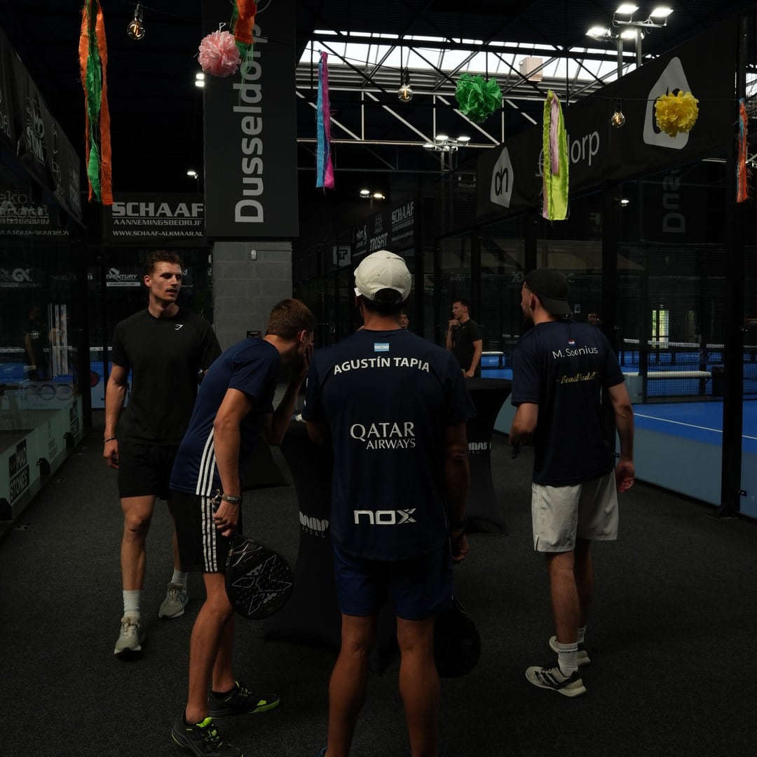 Founders with padel rackets on court before the first round